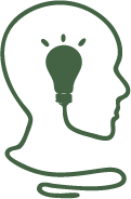 Green light bulb in head silhouette.