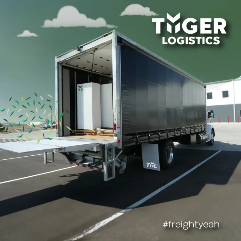What is a conestoga traielr? Tyger Logistics #freightyeah - a Conestoga truck with the back doors open in a parking lot.
